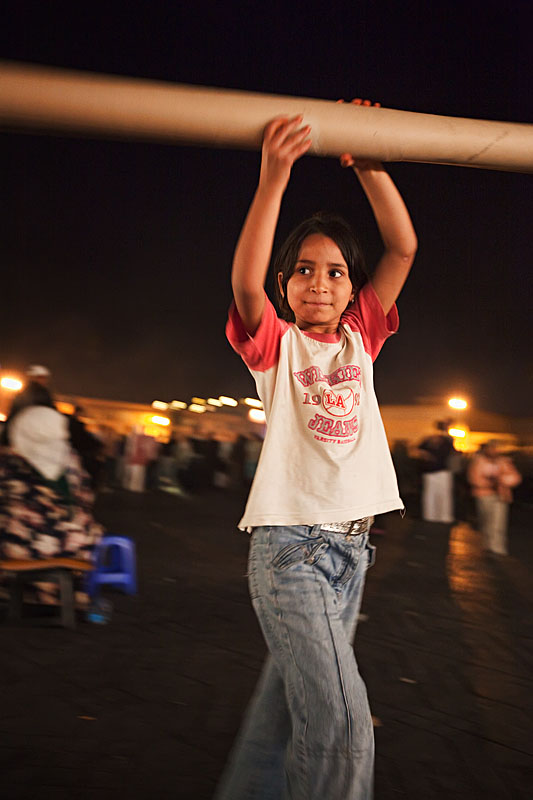  One of the many homeless children on Place Jemaa el Fna entertains herself (little artist)